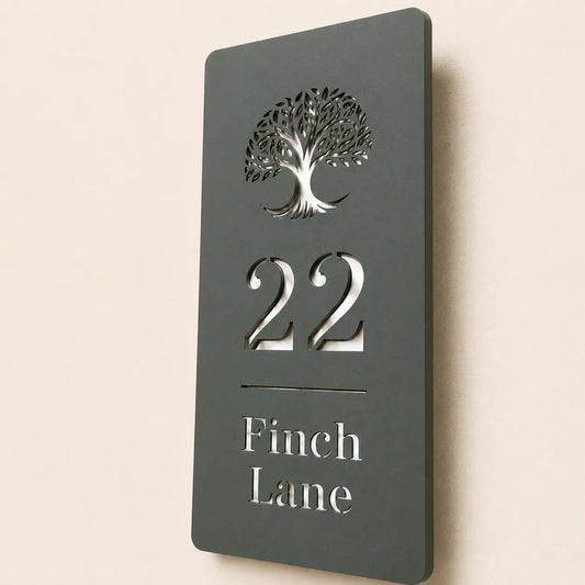 Close-up angled view of personalised pine green acrylic house sign with mirror silver detailing