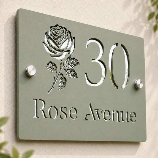 Close-up of personalised sage green acrylic house sign showing mirror silver rose, number and address details