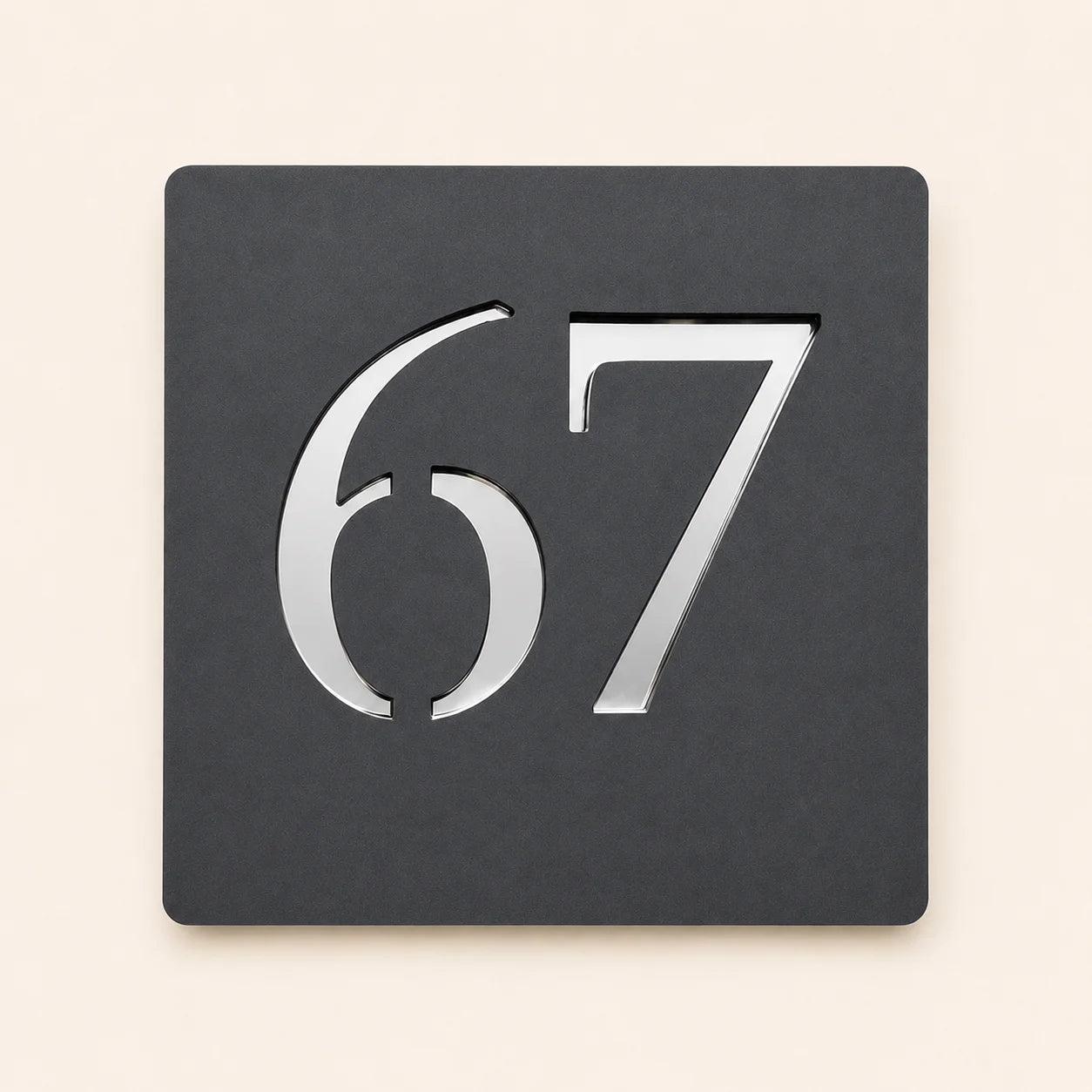 Contemporary anthracite grey acrylic house number sign with raised silver mirror number 67, suitable for modern homes and new builds.