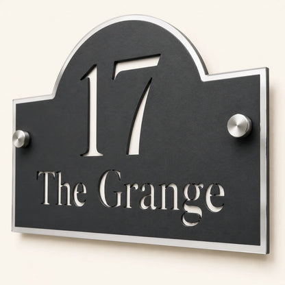 Close-up angled view of personalised black acrylic Arch house sign with mirror silver detailing