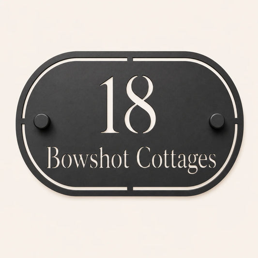 Personalised black oval acrylic house sign with mirror silver house number and house name