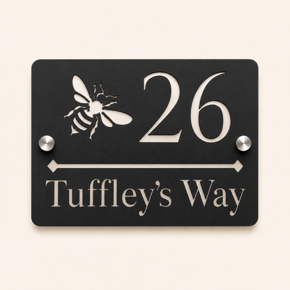 Personalised black rectangular acrylic house sign with mirror silver bee design, house number and street name