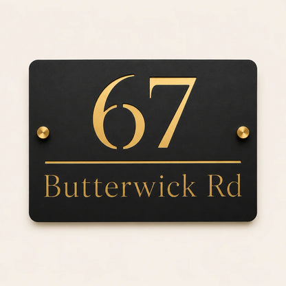 Personalised black rectangular acrylic house sign with mirror gold house number and street name