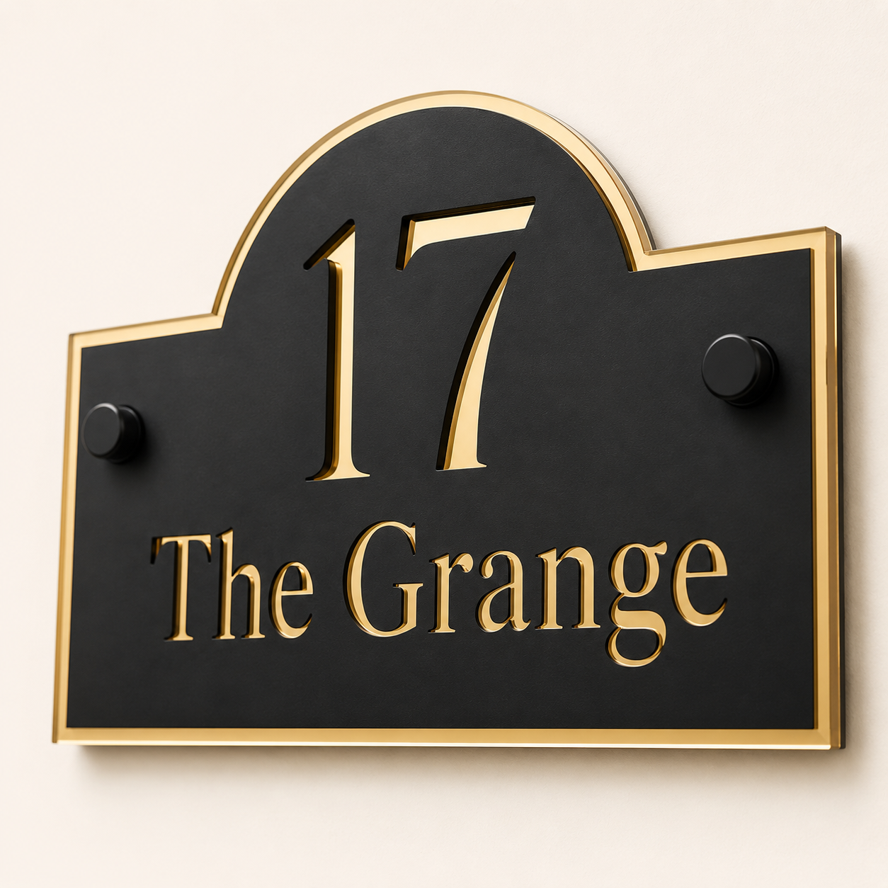 Close up of personalised black and mirror gold arch acrylic house sign showing layered detail