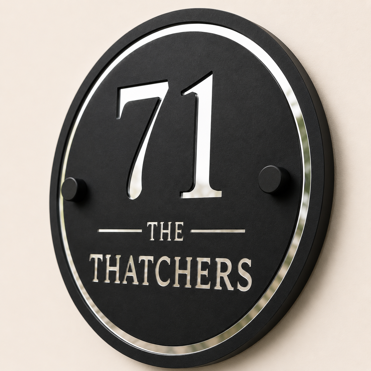 Close up of personalised black and mirror silver acrylic house sign showing layered detail
