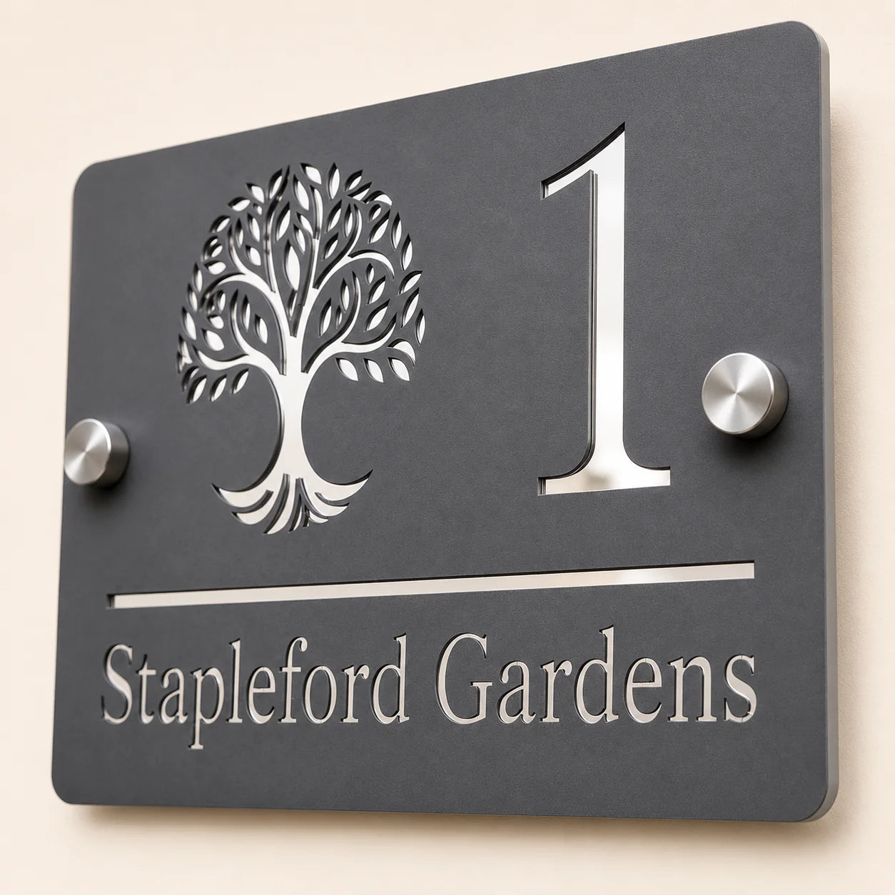 Close-up angled view of personalised mineral grey rectangular acrylic house sign with mirror silver tree design
