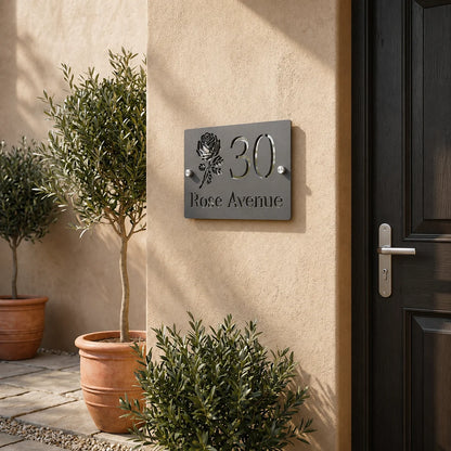 Personalised mineral grey rectangular acrylic house sign with mirror silver rose design mounted beside a front door