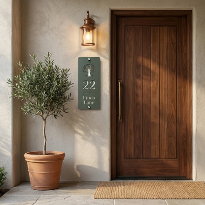 Personalised pine green and mirror silver acrylic house sign displayed beside a modern wooden front door