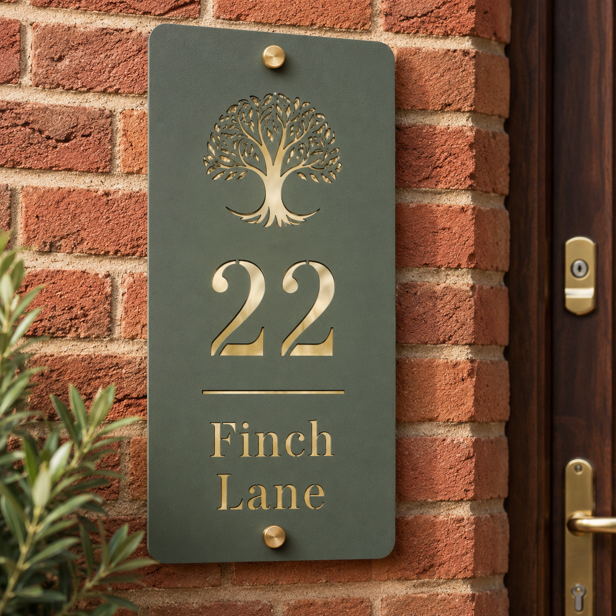 Personalised pine green and mirror gold vertical acrylic house sign mounted on an exterior brick wall