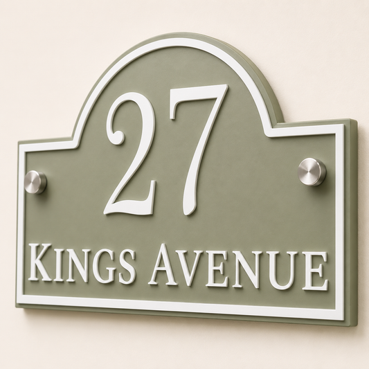 Close up of personalised sage green arch acrylic house sign showing raised white lettering and layered detail